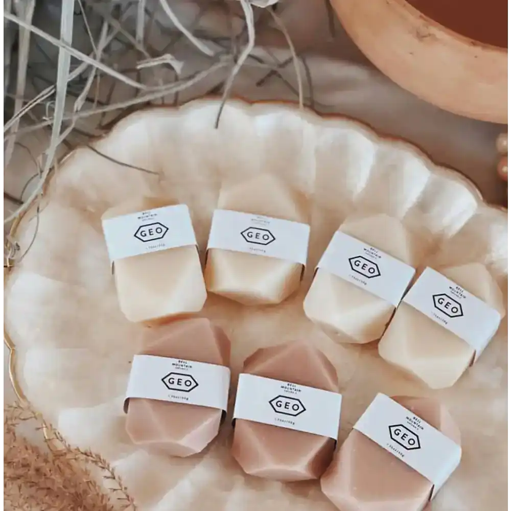 Geometric soaps with paper labels.